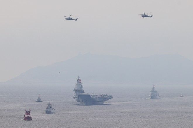 China Massing Military Ships Across Region in Show of Maritime Force, Sources Say